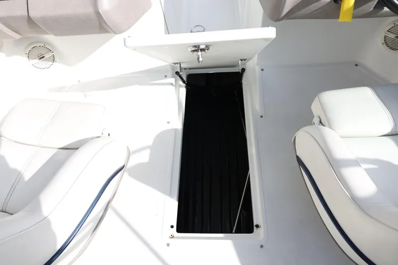 Slide: The Image of Interior of a 2005 Cobalt 200 boat showing seating and storage compartment. - 28