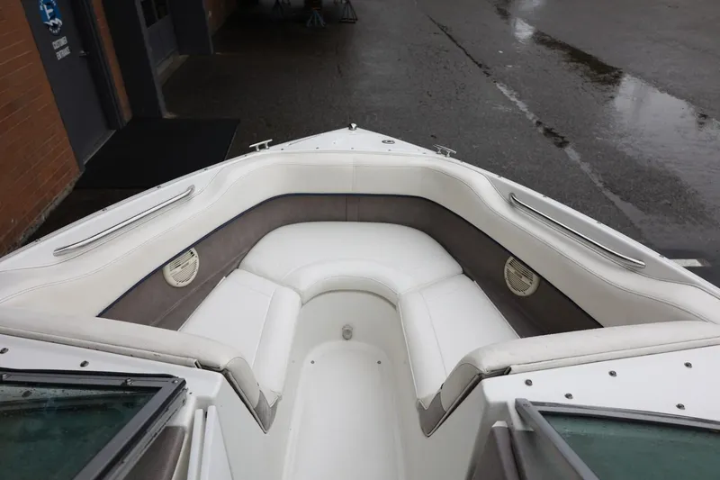 Slide: The Image of Front seating area of a 2005 Cobalt 200 boat with white upholstery. - 35