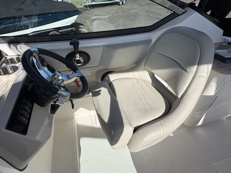 Slide: The Image of Interior of 2023 Boston Whaler 240 Vantage with steering wheel and seat. - 10