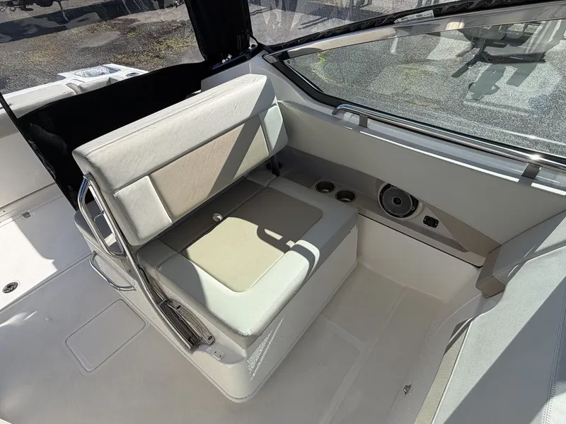 Slide: The Image of Interior of 2023 Boston Whaler 240 Vantage with seating and speaker. - 12