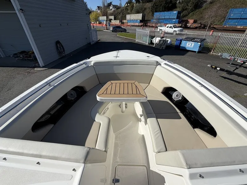 Slide: The Image of 2023 Boston Whaler 240 Vantage with comfortable seating and table. - 13