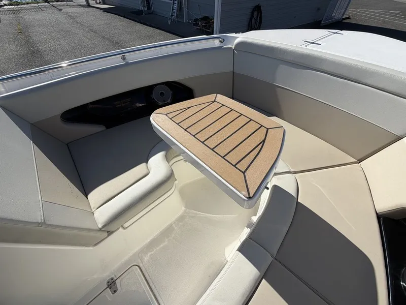 Slide: The Image of Interior of 2023 Boston Whaler 240 Vantage with table and seating area. - 14