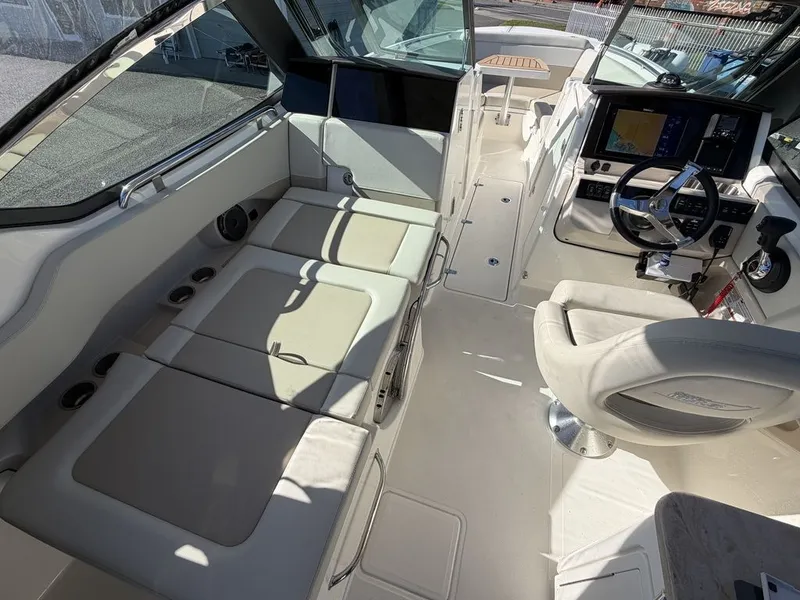 Slide: The Image of Interior of 2023 Boston Whaler 240 Vantage with helm and seating area. - 6