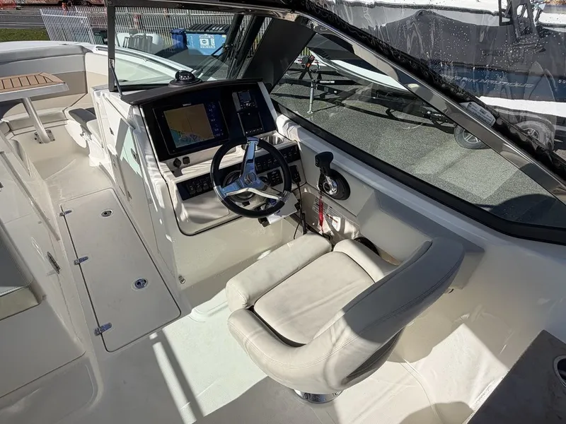 Slide: The Image of Interior of 2023 Boston Whaler 240 Vantage with helm console. - 9