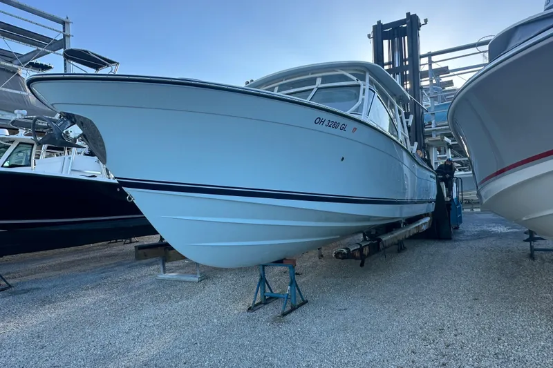 Slide: The Image of 2024 Grady-White Freedom 307 boat on dry dock, side view. - 4