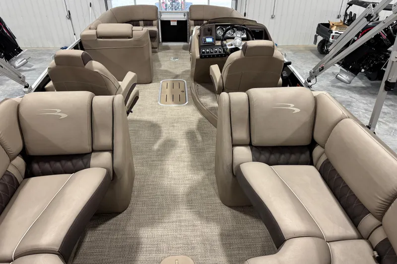 Slide: The Image of Luxurious interior of a 2019 Bennington R23 pontoon boat with plush seating and modern dashboard. - 10