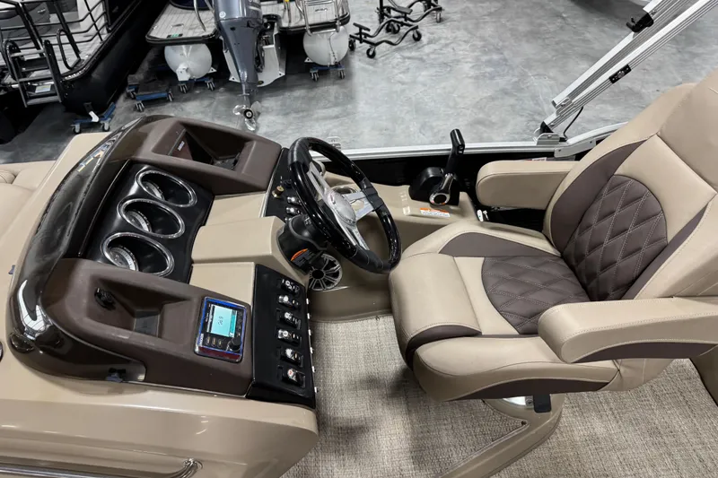 Slide: The Image of 2019 Bennington R23 boat interior with steering wheel and luxurious seating. - 11