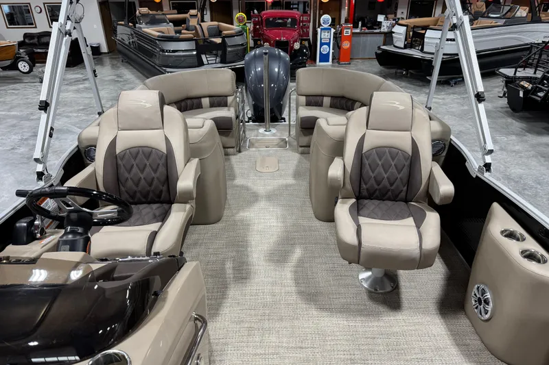 Slide: The Image of 2019 Bennington R23 pontoon boat interior with plush seating and modern design. - 13