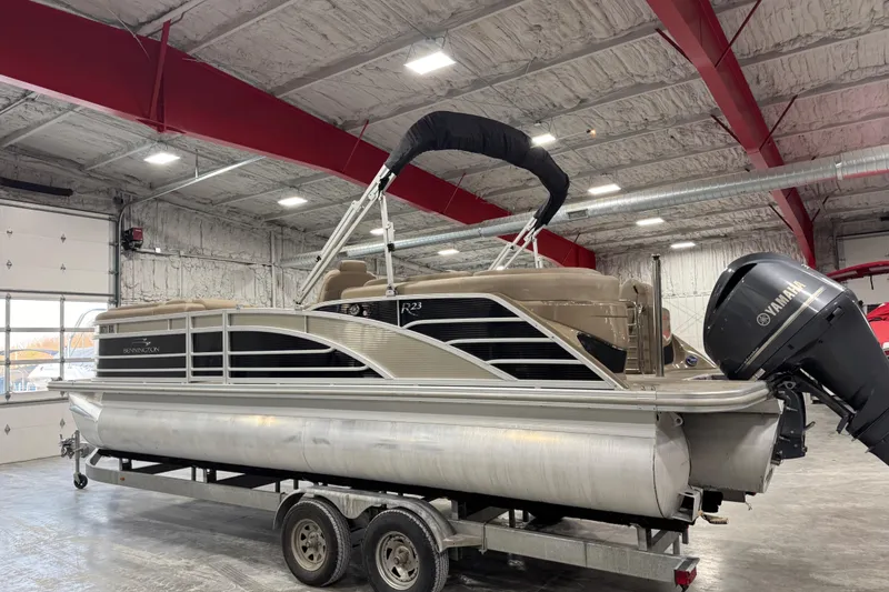 Slide: The Image of 2019 Bennington R23 pontoon boat on trailer in indoor storage facility. - 3