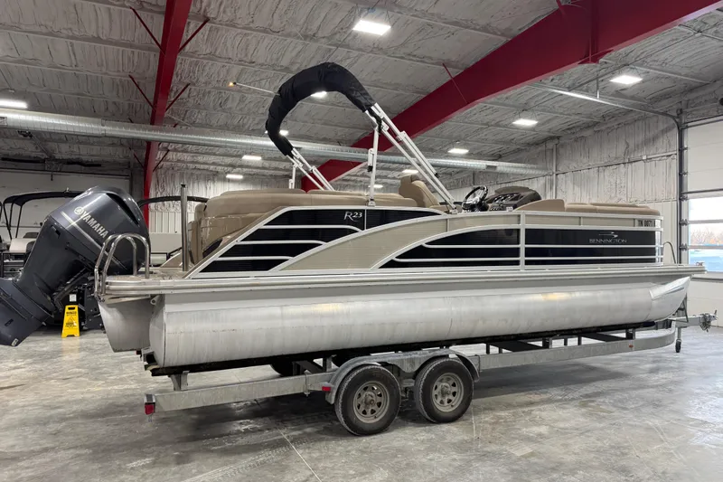 Slide: The Image of 2019 Bennington R23 pontoon boat on trailer in indoor storage facility. - 4