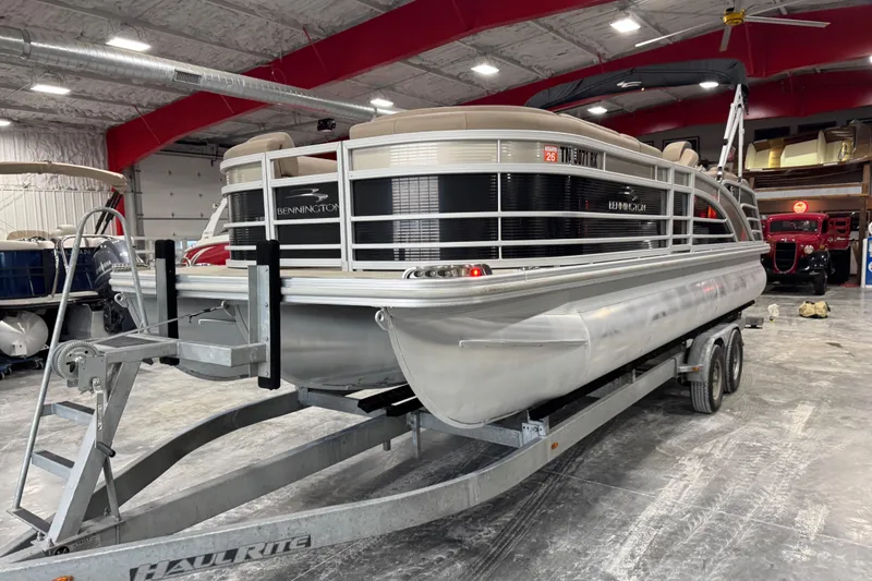 Slide: The Image of 2019 Bennington R23 pontoon boat on trailer in indoor storage facility. - 5