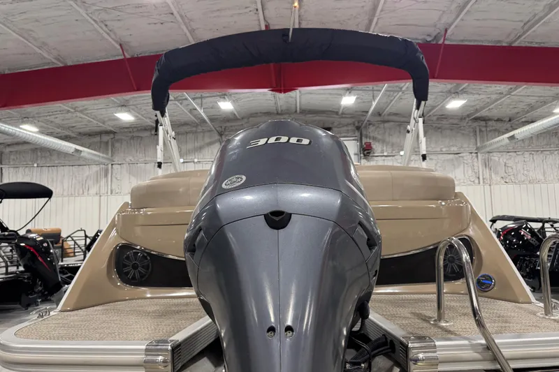 Slide: The Image of 2019 Bennington R23 boat with powerful 300 HP engine in indoor showroom. - 6
