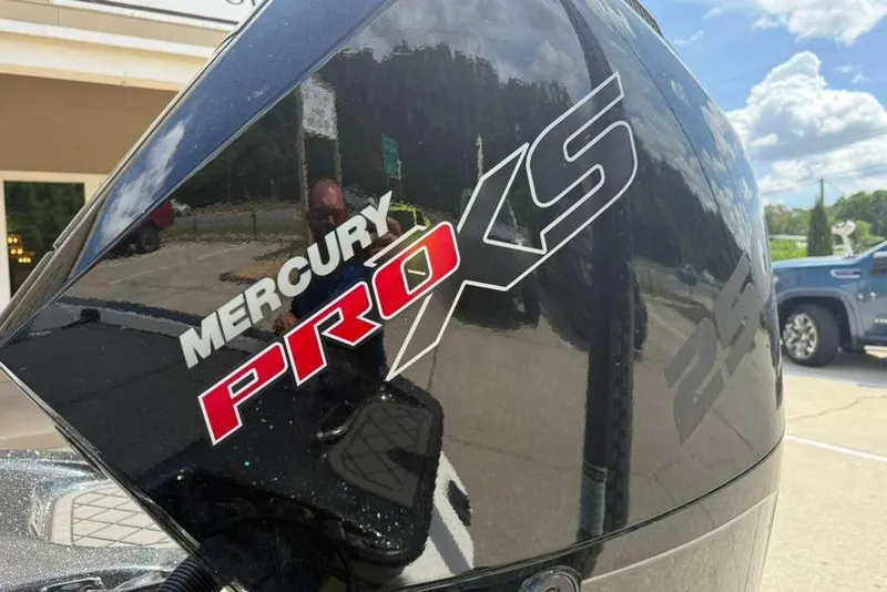 Slide: The Image of Mercury Pro XS engine on 2025 Caymas CX 20 PRO boat, outdoor setting. - 14