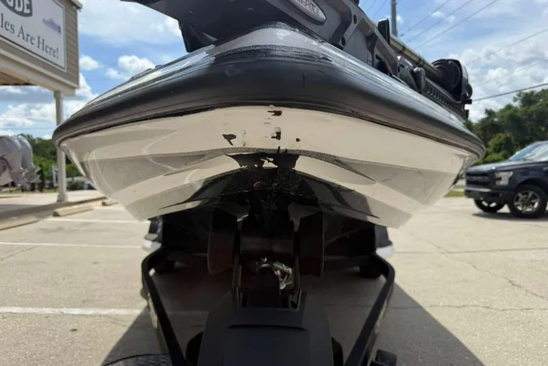 Slide: The Image of 2025 Caymas CX 20 PRO boat on trailer, viewed from the front in a parking lot. - 19