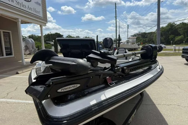 Slide: The Image of 2025 Caymas CX 20 PRO boat with Power-Pole and Garmin equipment, parked outdoors. - 20