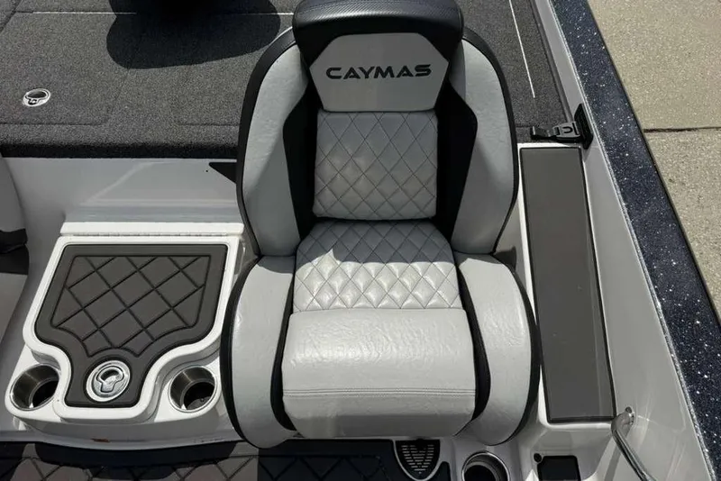 Slide: The Image of 2025 Caymas CX 20 PRO boat seat with diamond-stitched upholstery and integrated cup holders. - 24