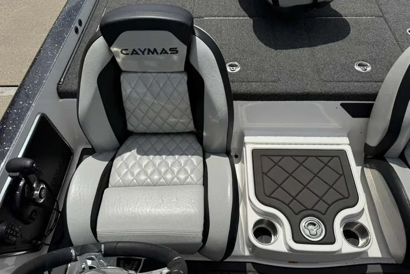 Slide: The Image of 2025 Caymas CX 20 PRO boat interior with quilted seats and cup holders. - 25