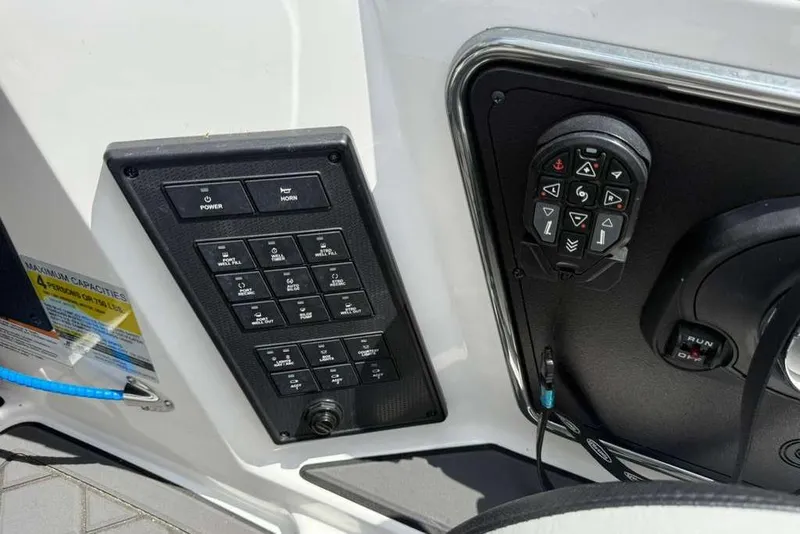 Slide: The Image of Control panel of 2025 Caymas CX 20 PRO boat with switches and joystick. - 27