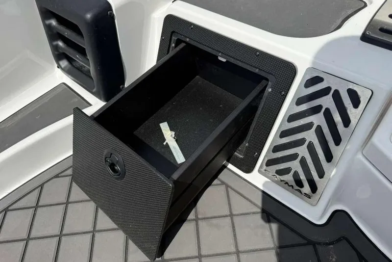 Slide: The Image of Open storage compartment in 2025 Caymas CX 20 PRO boat, featuring sleek design and functionality. - 28