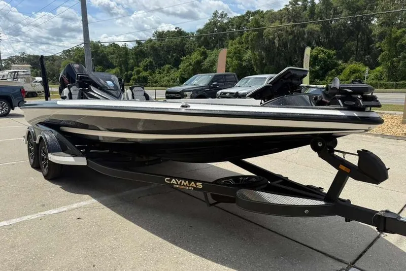 Slide: The Image of 2025 Caymas CX 20 PRO boat on trailer, parked outdoors, showcasing sleek design. - 30