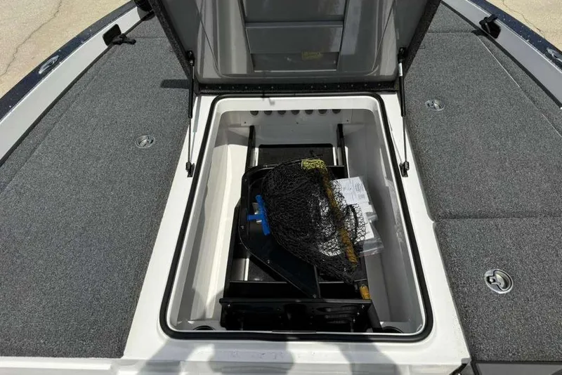 Slide: The Image of 2025 Caymas CX 20 PRO boat storage compartment with fishing gear and accessories. - 32