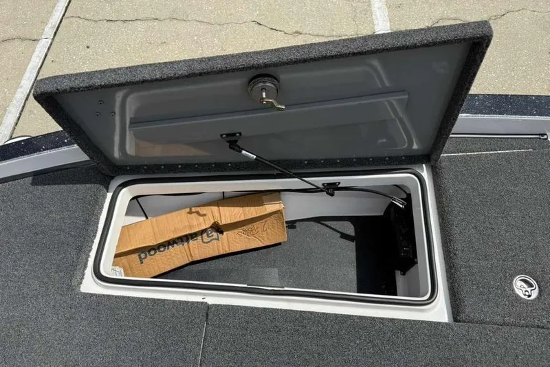 Slide: The Image of Open storage compartment on 2025 Caymas CX 20 PRO boat, showing interior space. - 34