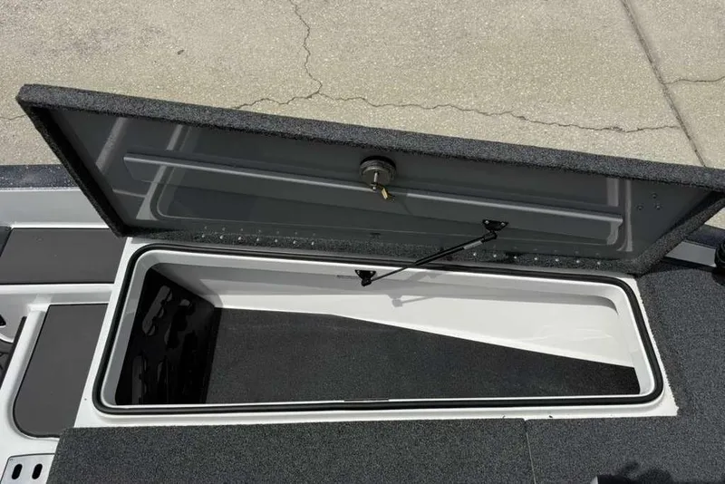 Slide: The Image of Open storage compartment on 2025 Caymas CX 20 PRO boat, showcasing interior space. - 36