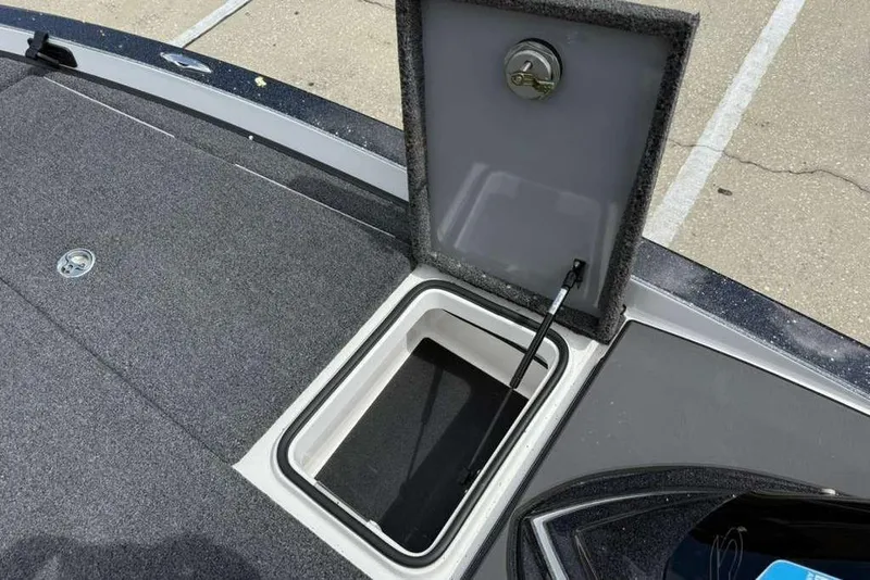 Slide: The Image of Open storage compartment on 2025 Caymas CX 20 PRO boat deck. - 37