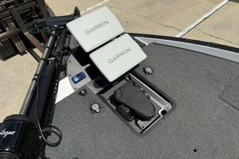 Slide: The Image of 2025 Caymas CX 20 PRO boat deck with dual Garmin displays and foot pedal controls. - 41