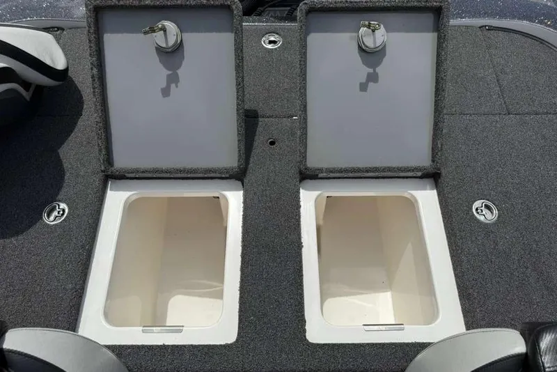 Slide: The Image of 2025 Caymas CX 20 PRO boat storage compartments with open lids, showcasing interior space. - 44