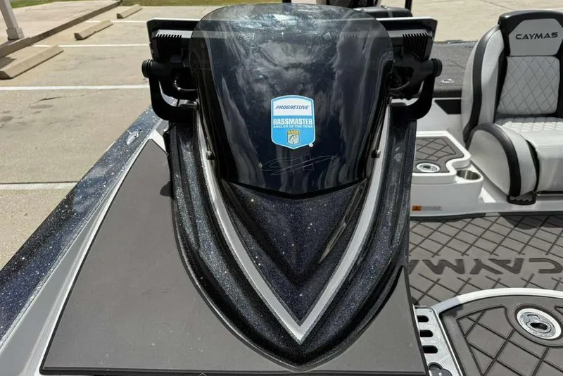 Slide: The Image of 2025 Caymas CX 20 PRO boat with Bassmaster sticker, featuring sleek design and comfortable seating. - 48