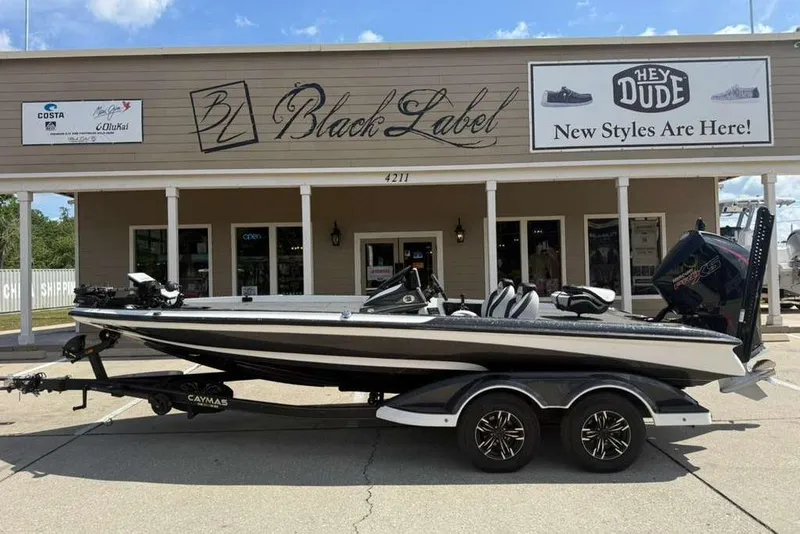Slide: The Image of 2025 Caymas CX 20 PRO boat parked outside Black Label store. - 9