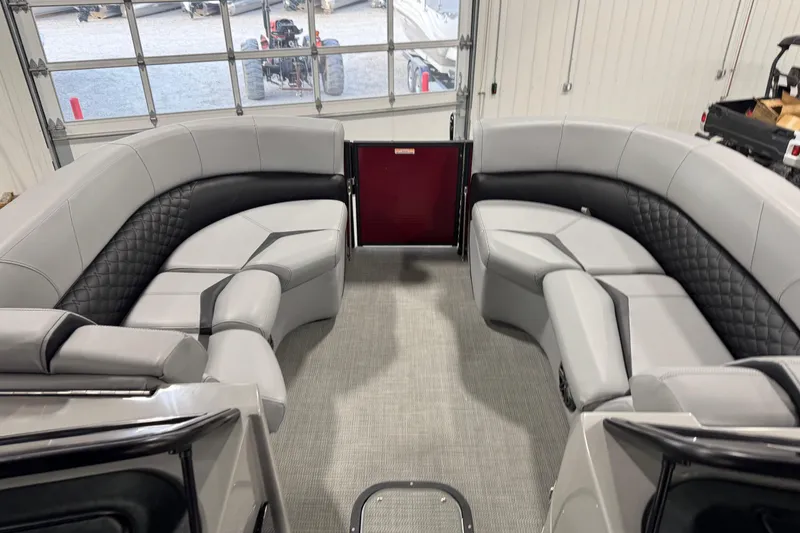 Slide: The Image of Interior of a 2021 Manitou 25 LX pontoon boat with luxurious seating. - 14