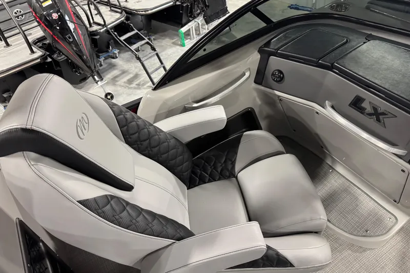 Slide: The Image of Luxurious interior of 2021 Manitou 25 LX boat with plush seating and sleek design. - 15