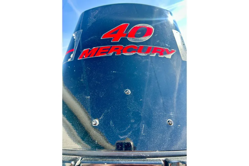 Slide: The Image of Close-up of a Mercury 40 outboard motor on a 2004 Starcraft D-Star 160 DLX SC boat. - 13
