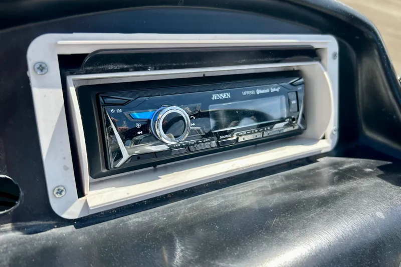 Slide: The Image of Jensen MPR221 Bluetooth stereo in 2004 Starcraft D-Star 160 DLX SC dashboard. - 15