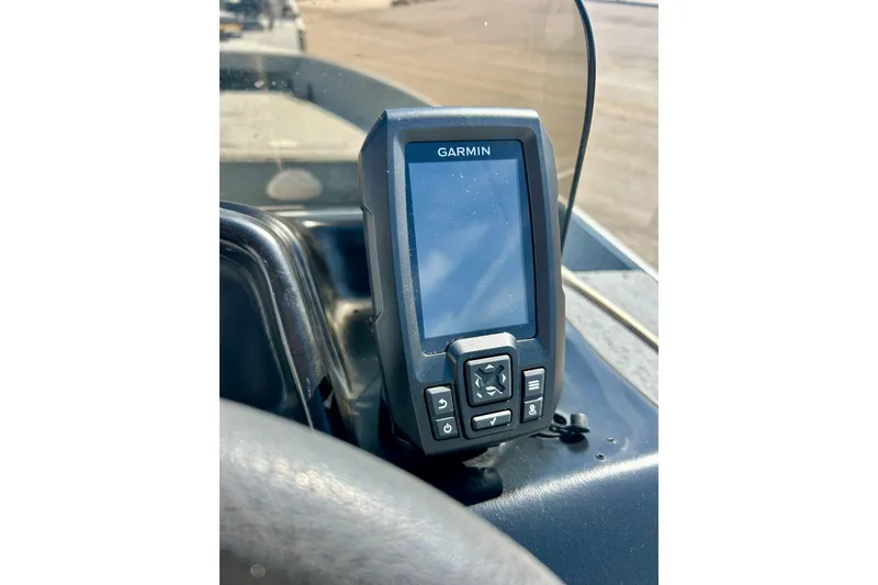 Slide: The Image of Garmin GPS device mounted on a 2004 Starcraft D-Star 160 DLX SC boat dashboard. - 16
