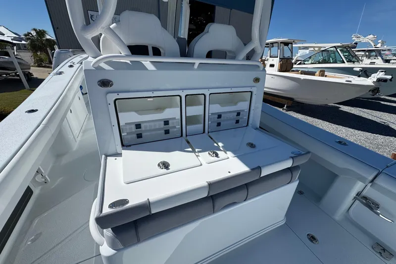Slide: The Image of 2026 Yellowfin 36 Offshore boat interior with seating and storage compartments. - 13