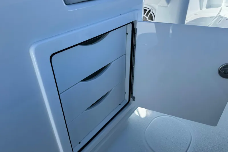 Slide: The Image of Storage compartment with open door on 2026 Yellowfin 36 Offshore boat. - 15