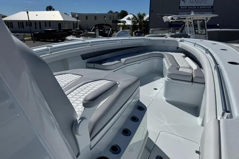 Slide: The Image of 2026 Yellowfin 36 Offshore boat interior with cushioned seating and sleek design. - 23