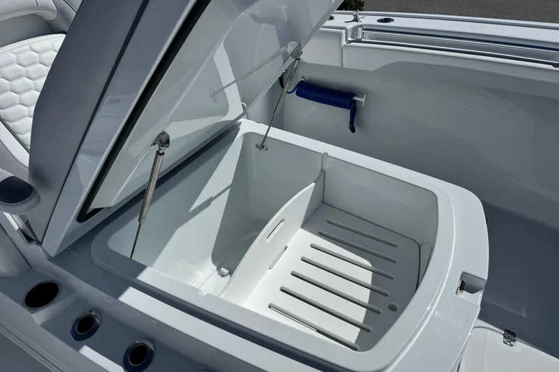 Slide: The Image of Open storage compartment on 2026 Yellowfin 36 Offshore boat, showcasing interior design. - 25