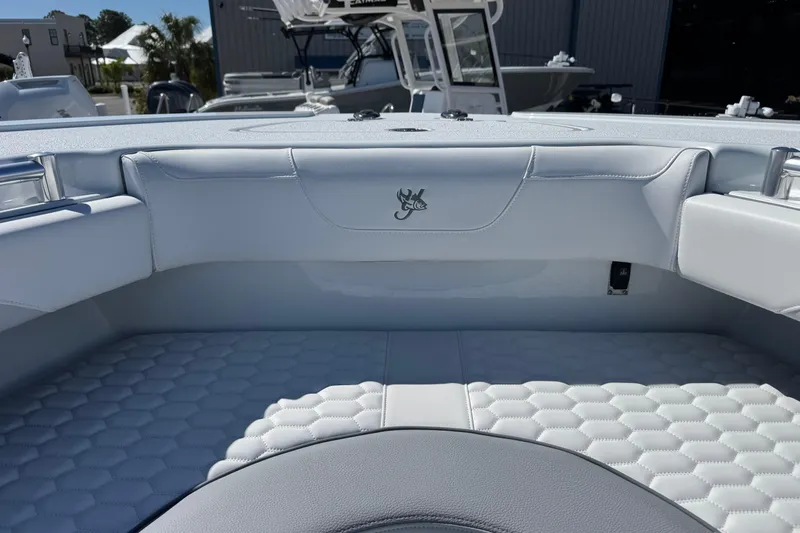 Slide: The Image of 2026 Yellowfin 36 Offshore boat interior with hexagonal-patterned seating and sleek design. - 27