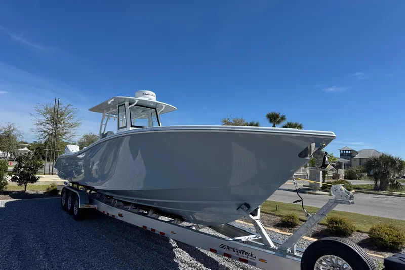 Slide: The Image of 2026 Yellowfin 36 Offshore boat on trailer under clear blue sky. - 8