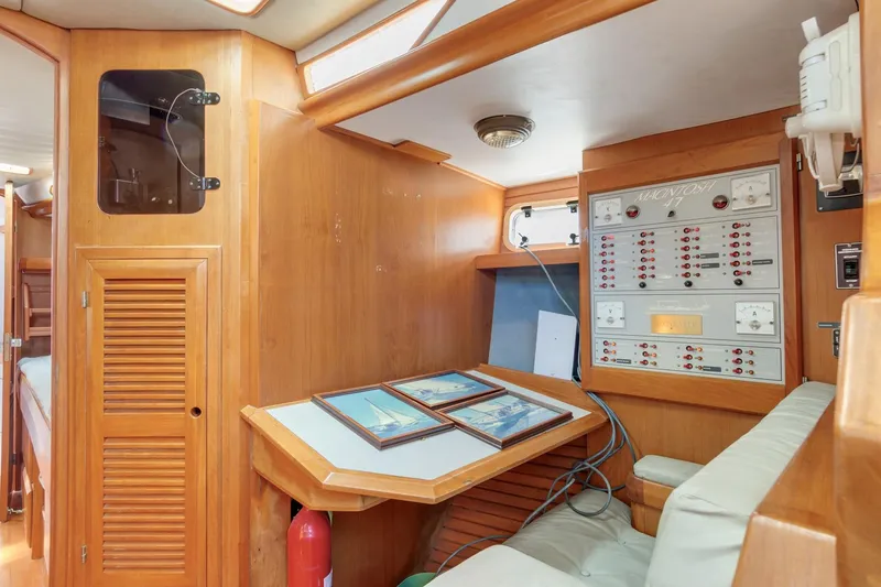 Slide: The Image of 1987 Macintosh Center Cockpit interior with navigation station and control panel. - 12