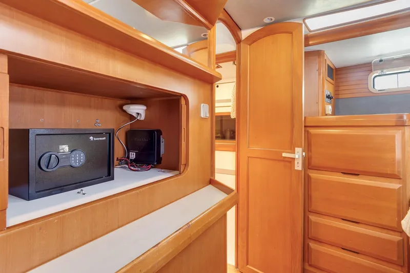 Slide: The Image of Interior of 1987 Macintosh Center Cockpit with safe and wooden cabinetry. - 17