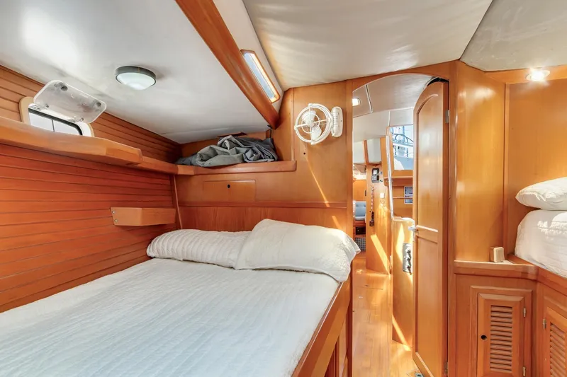 Slide: The Image of Interior of 1987 Macintosh Center Cockpit yacht with cozy wooden cabin and bed. - 23