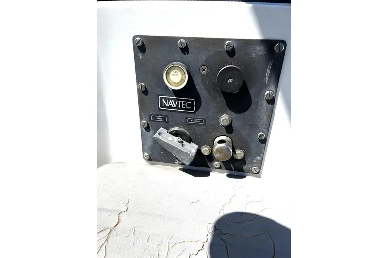 Slide: The Image of Control panel of a 1987 Macintosh Center Cockpit sailboat with Navtec system. - 32