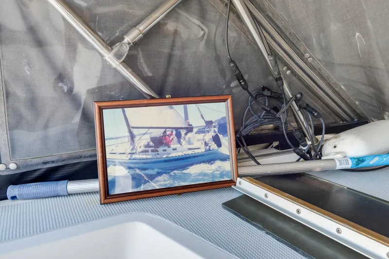 Slide: The Image of Framed photo of a sailboat on a 1987 Macintosh Center Cockpit yacht. - 46