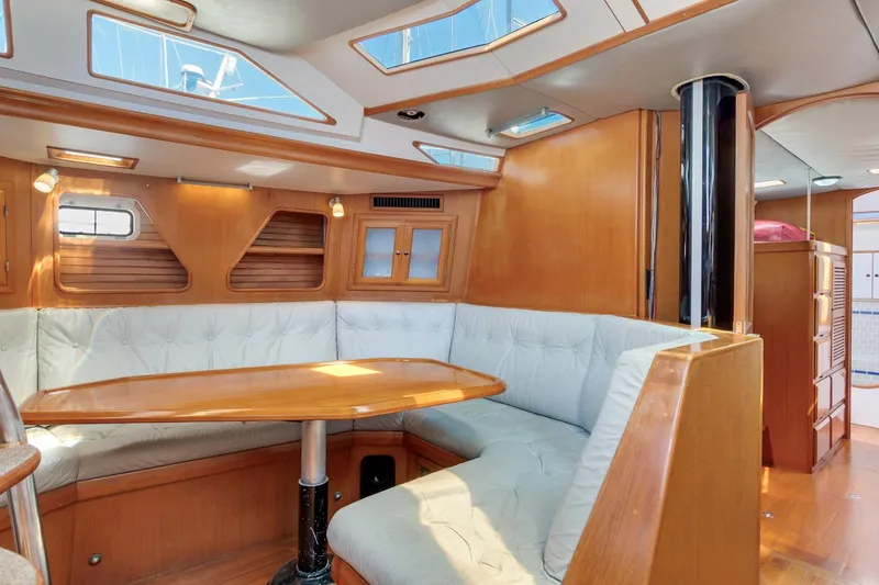 Slide: The Image of Interior of 1987 Macintosh Center Cockpit yacht with wooden furnishings and cushioned seating. - 6