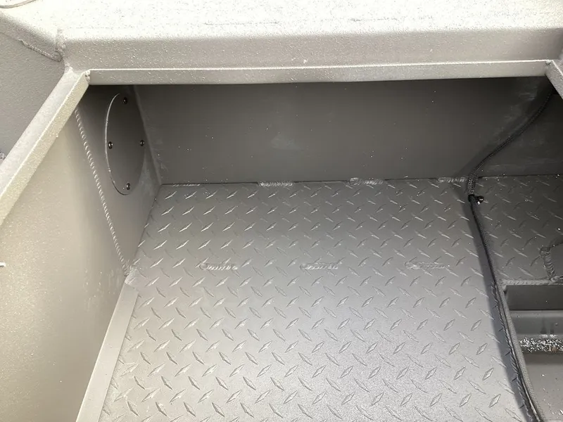 Slide: The Image of Interior of Reaper 656 from 2026 with diamond plate flooring. - 13